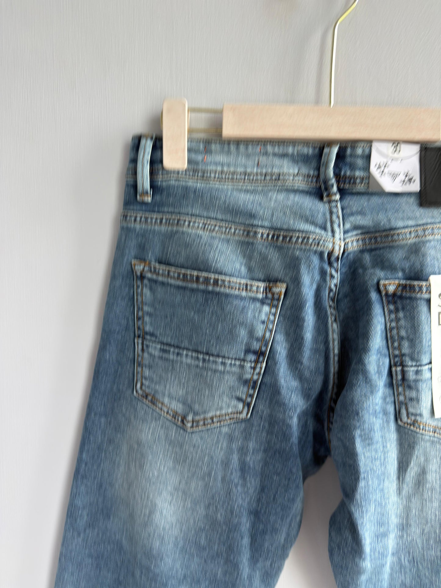 LIGHT BLUE TORN DENIM TROUSER